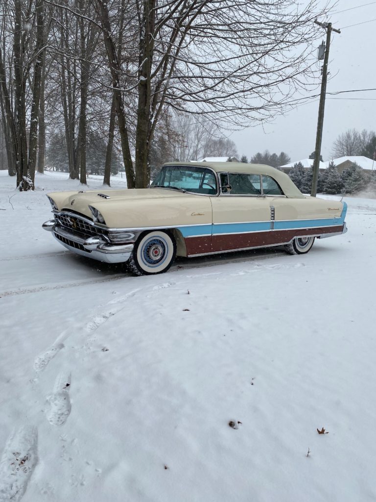 1956 Packard Caribbean on a snowy driveway