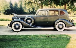 1936 Packard Model 1400 Eight Sedan on a driveway underneath a tree